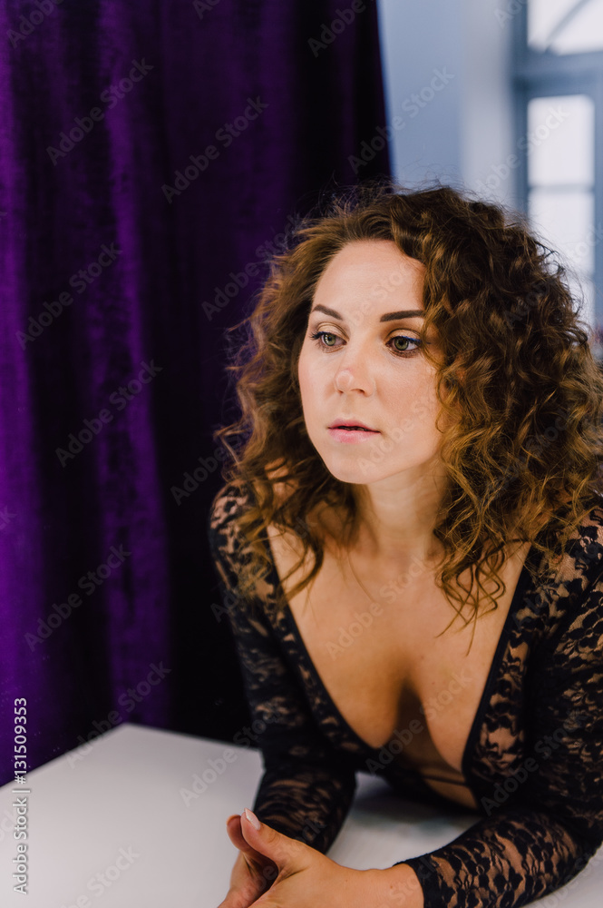 Sexy and beautiful woman wearing black lace body lingerie with curly hair Sexy and beautiful woman wearing black lace body lingerie with curly hair