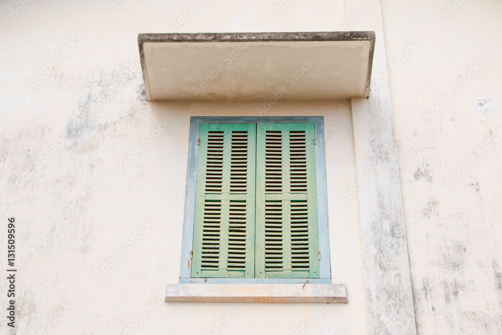 Green retro window. Old architectural element. Vibrant colors.