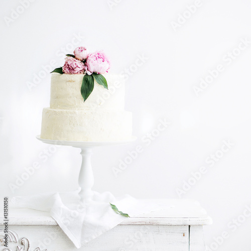 Amazing Wedding cake with decoration on white wooden table