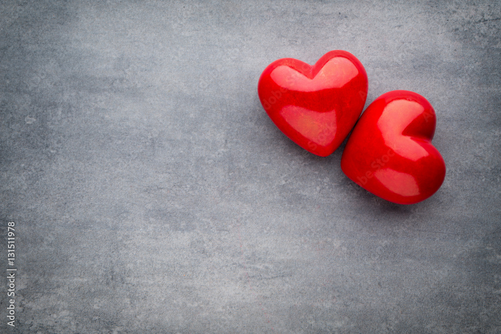 Red heart on the gray background.