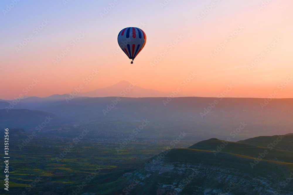 Hot air balloon flying in Cappadocia, Anatolia, Turkey.