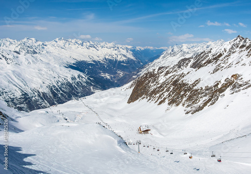 Ski slope and cable car on the ski resort in Austria, Alps. 