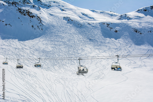 Ski slope and cable car on the ski resort in Austria, Alps. 