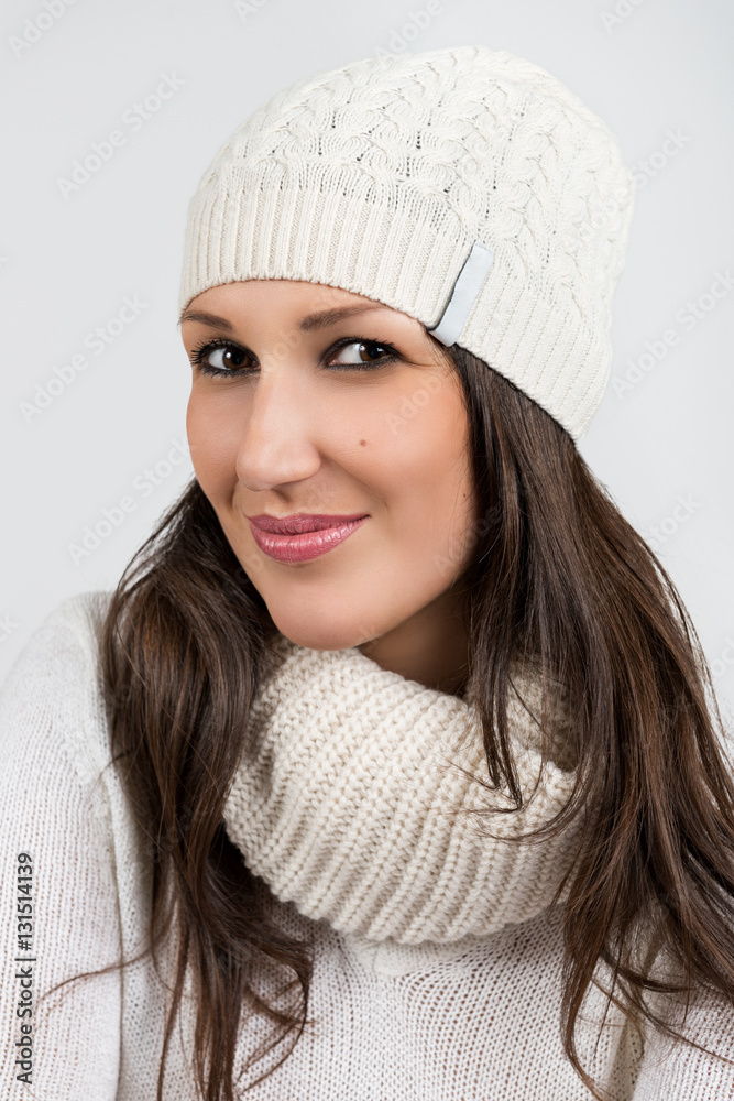 Portrait of a beautiful cheerful woman on a gray background Portrait of a beautiful cheerful woman on a gray background