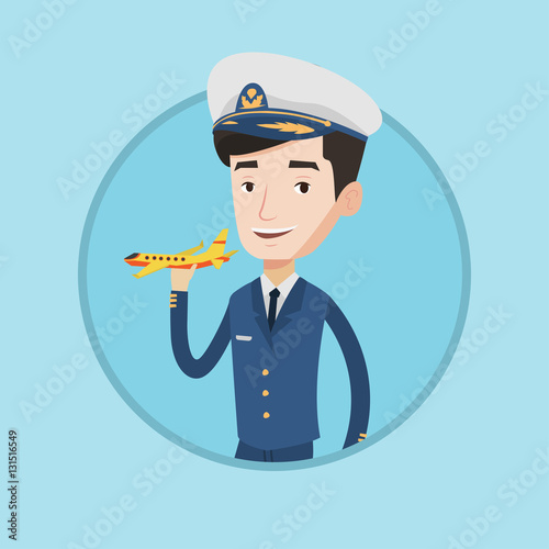 Cheerful airline pilot with model airplane.
