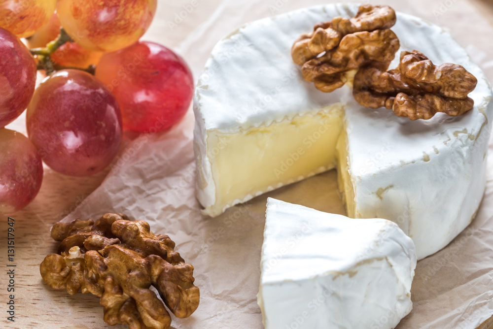 Camembert cheese with walnuts and grape Camembert cheese with walnuts and grape