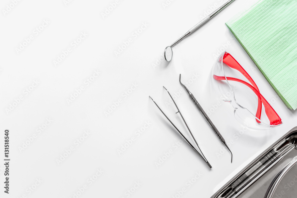dentists tools in cabinet on white desktop dentists tools in cabinet on white desktop