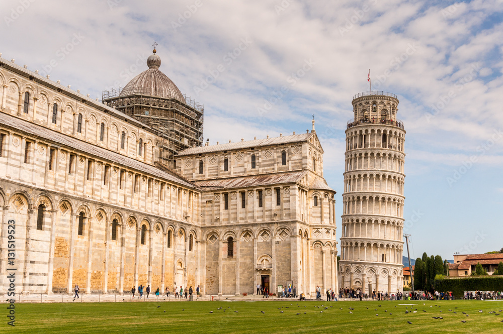 Pisa cathedral with baptistery and leaning tower on the field of Miracles in Pisa town of Italy