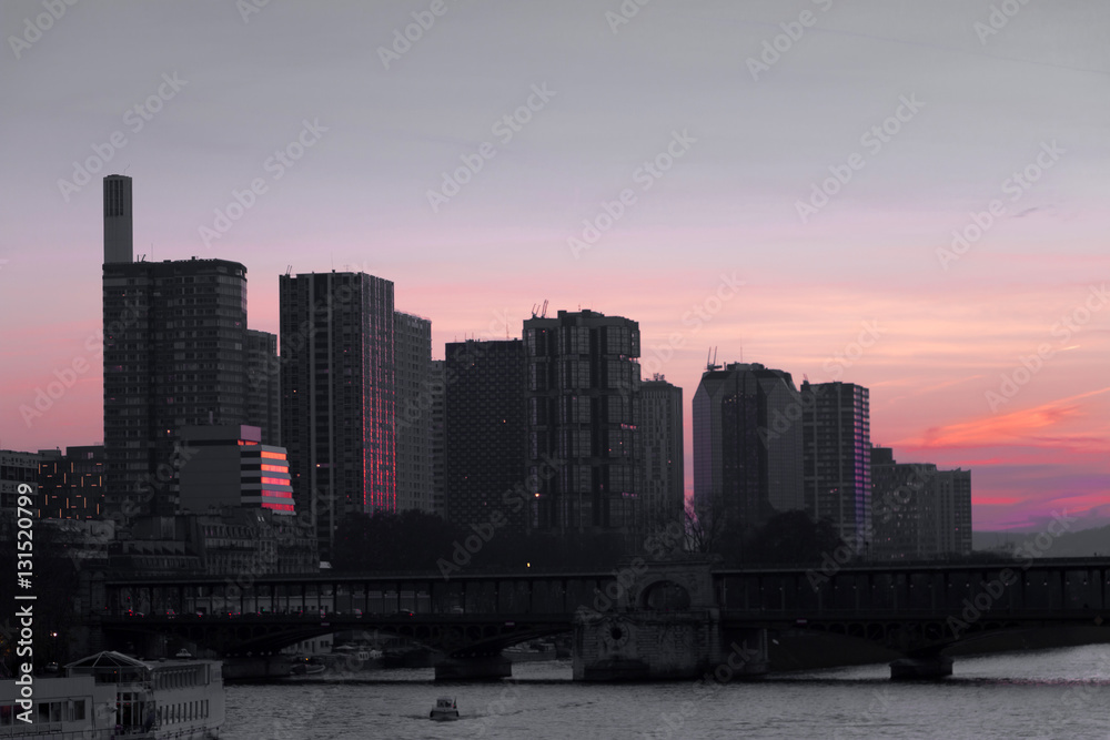 Cityscape with buildings, bridge, river and red sunset sky. Selective focus. Copy space, Toned image. Selective focus.