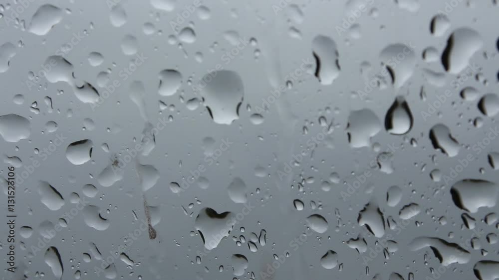Close-Up Of Rain On A Car Window Close-Up Of Rain On A Car Window