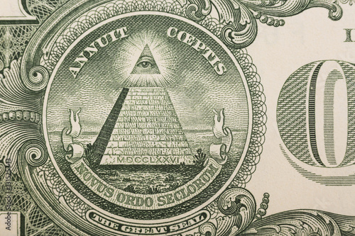 Close up of the pyramid and eye on the back of a one dollar bill photo