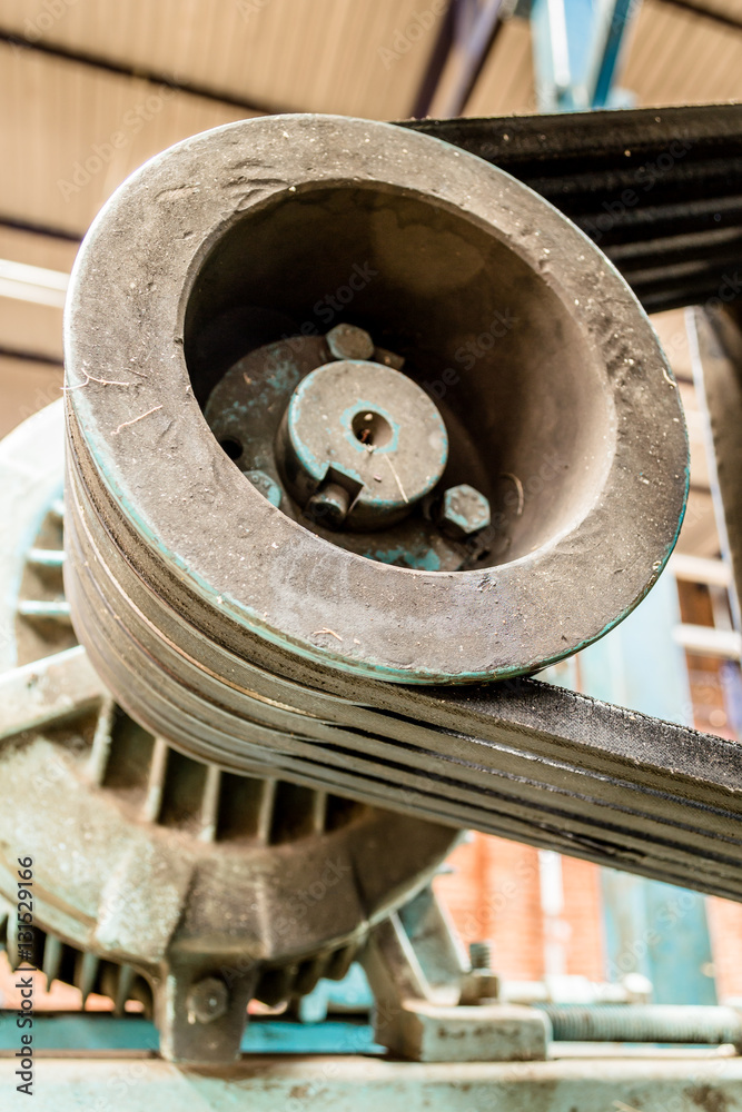 Vertical photo in color and shallow depth of field about an engine with rubber bands to work Vertical photo in color and shallow depth of field about an engine with rubber bands to work
