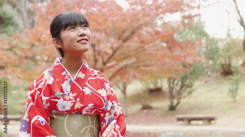 Japanese girl kimono sitting in Beautiful park Autumn leaves Japanese girl kimono sitting in Beautiful park Autumn leaves