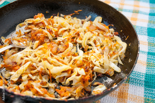 Spoon into pan braised cabbage with carrots  