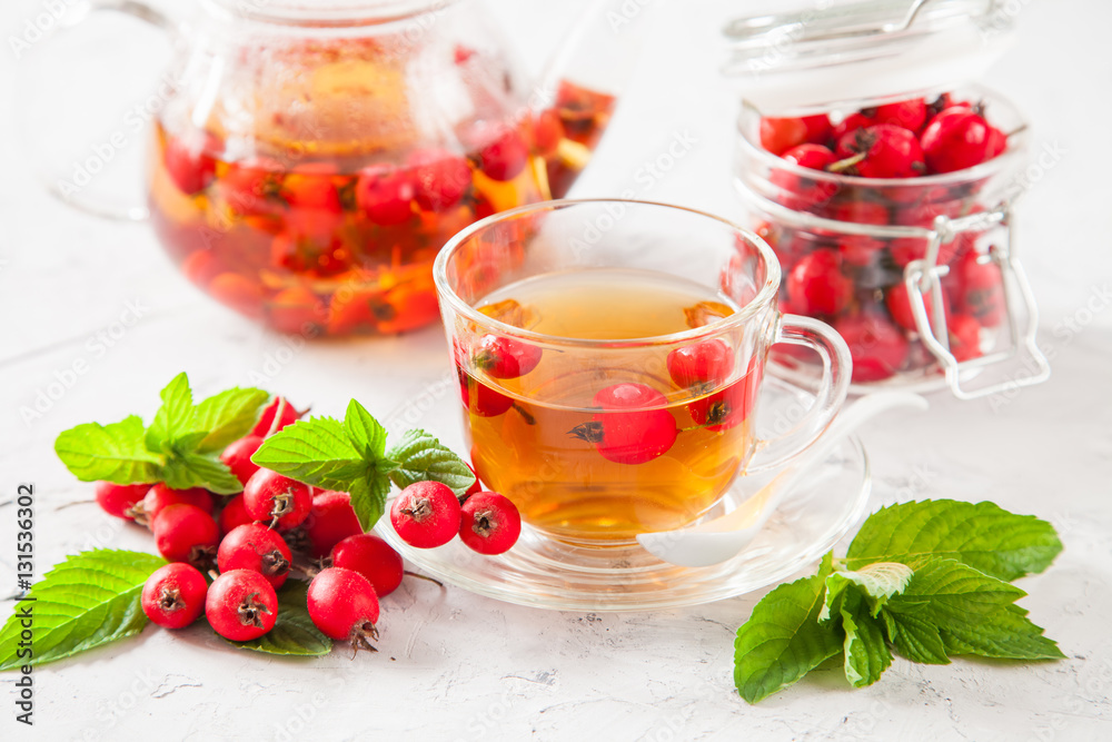 tea with a hawthorn and mint in a cup on a table, selective focus tea with a hawthorn and mint in a cup on a table, selective focus