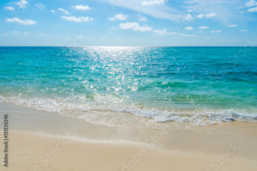 White clouds with blue sky over calm sea beach in tropical Mald