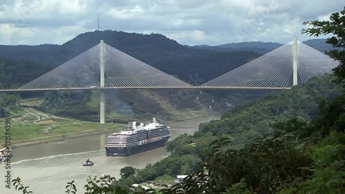 Cruise ship sailing under Panama Bridge