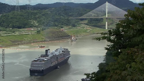 Cruise ship sailing under Panama Bridge