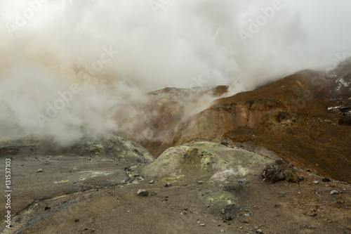 Beautiful slopes Mutnovsky volcano shrouded in clouds.