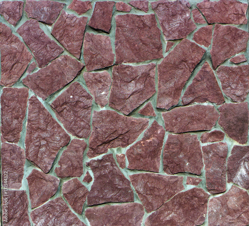 red granite, cobblestone wall, close-up texture