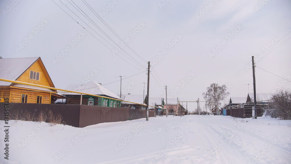 Russian typical countryside - winter village in center of Volga, snow cold day