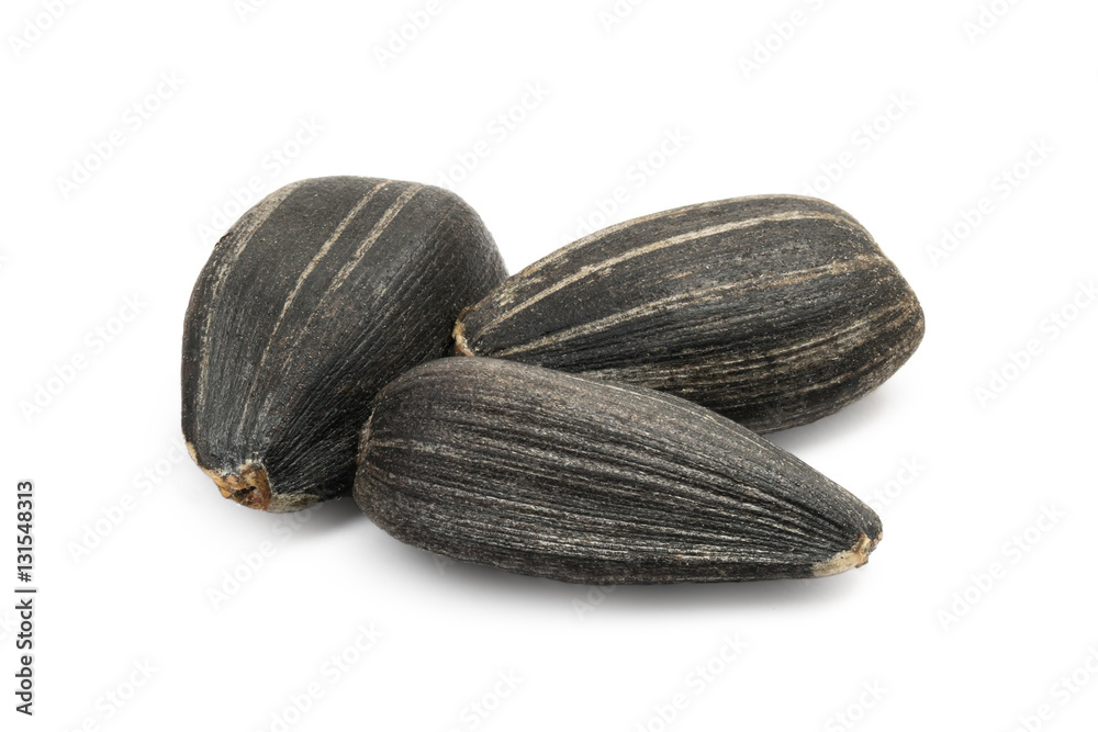 custom made wallpaper toronto digitalMacro photo of three black sunflower seeds isolated on white with large DOF