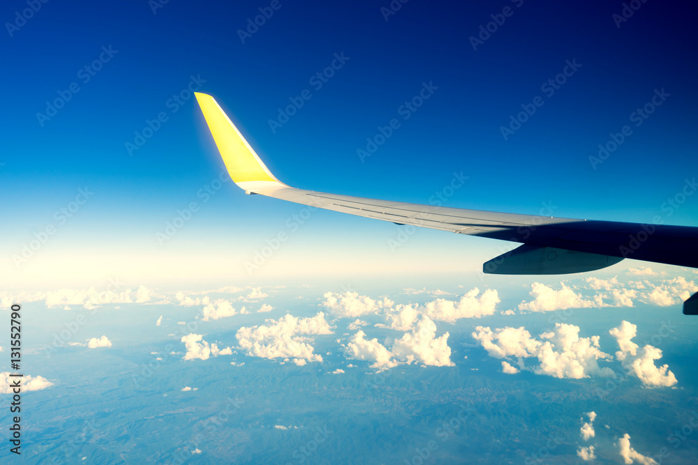 Fototapeta premium Planes flying over a cloudy sky.