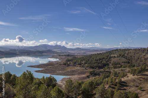 Reservoir landscape with windmills at bottom © WH_Pics