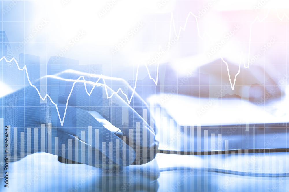 Double exposure of businessman using computer mouse, financial buildings Double exposure of businessman using computer mouse, financial buildings