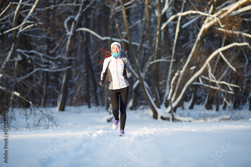 Sportswoman on jogging in winter