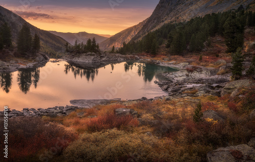 Fototapeta Naklejka Na Ścianę i Meble -  Pink Sky And Mirror Like Lake On Sunset With Red Color Growth On Foreground, Altai Mountains Highland Nature Autumn Landscape Photo