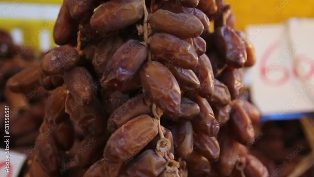 Big bunch of dates closeup at Tunisian market with refocus from the price-list 6000 tunisian dinares (50 fps, 720p)