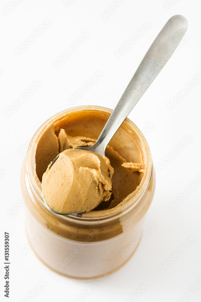 Creamy peanut butter and spoon isolated on white background
Creamy peanut butter and spoon isolated on white background