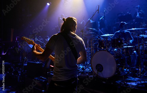 The guitarist plays solo.