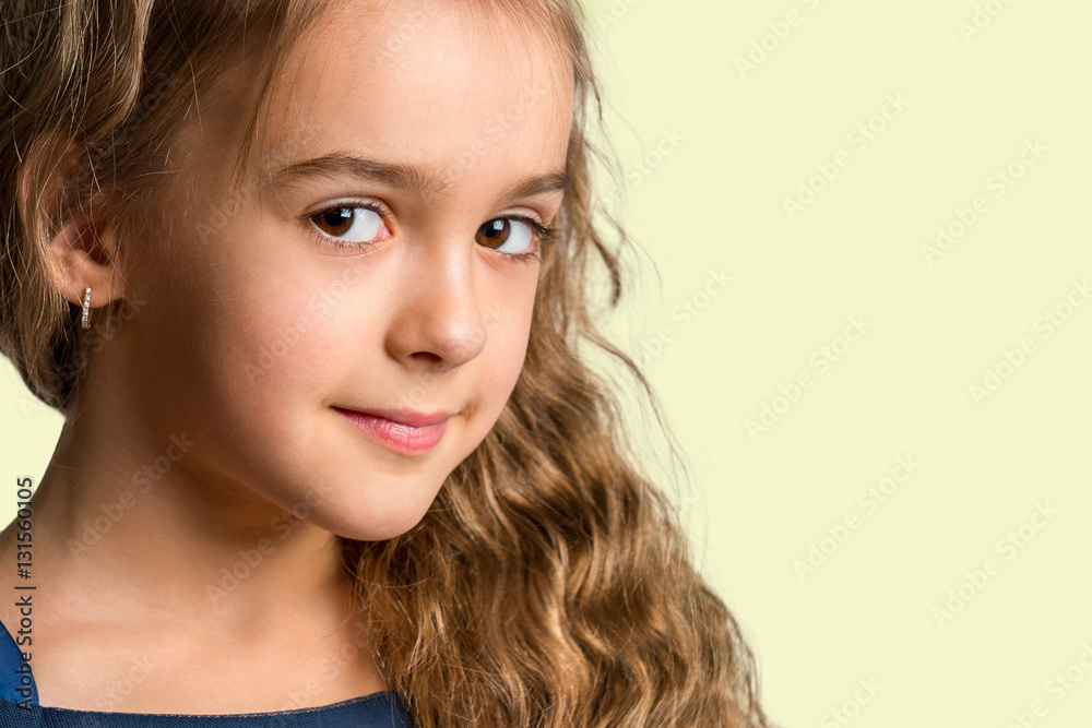 Portrait of a beautiful young girl closeup. Face of a happy child Portrait of a beautiful young girl closeup. Face of a happy child