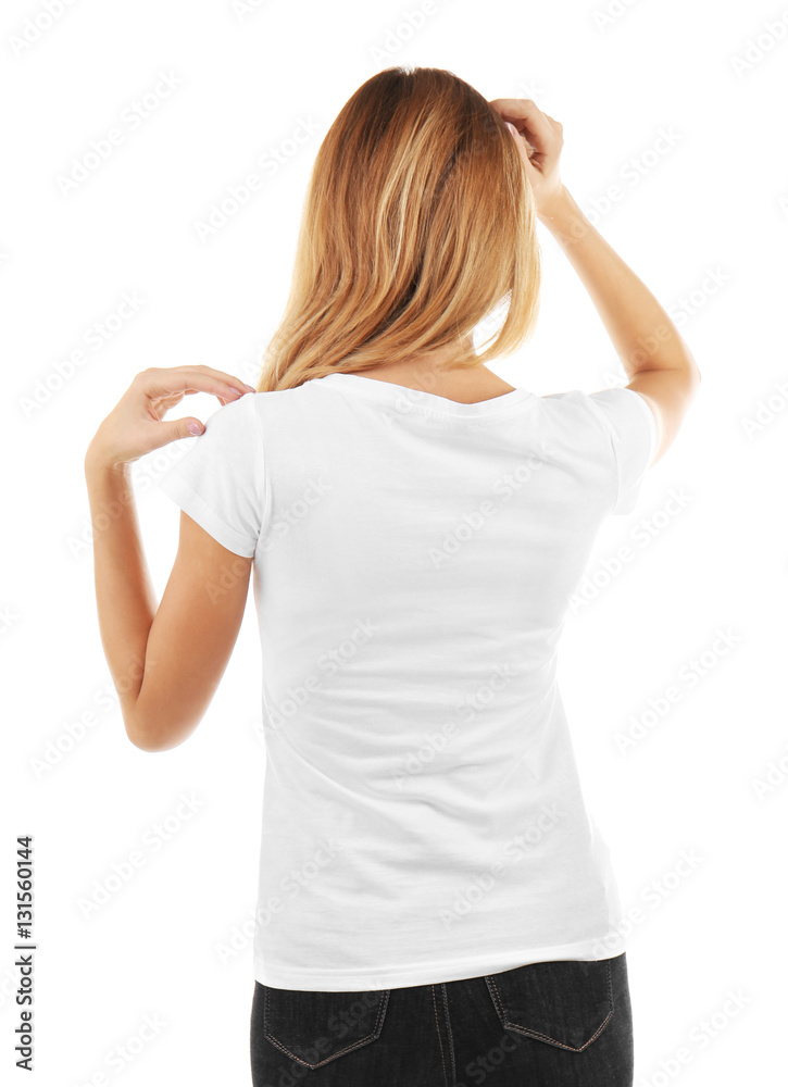 Fototapeta premium Young woman in blank t-shirt on white background