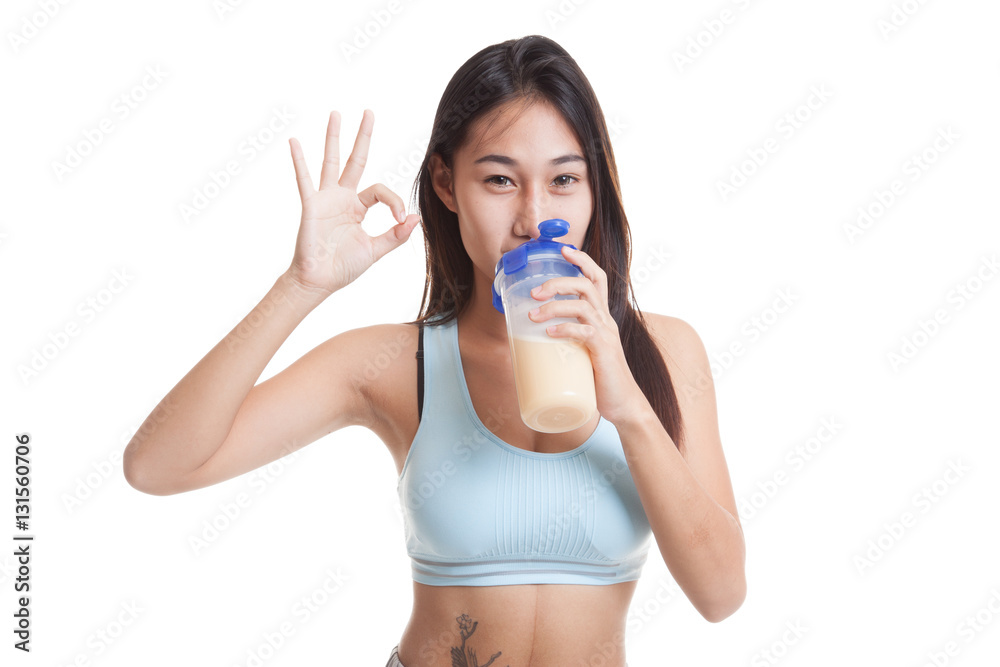Beautiful Asian healthy girl show OK drink whey protein. Beautiful Asian healthy girl show OK drink whey protein.