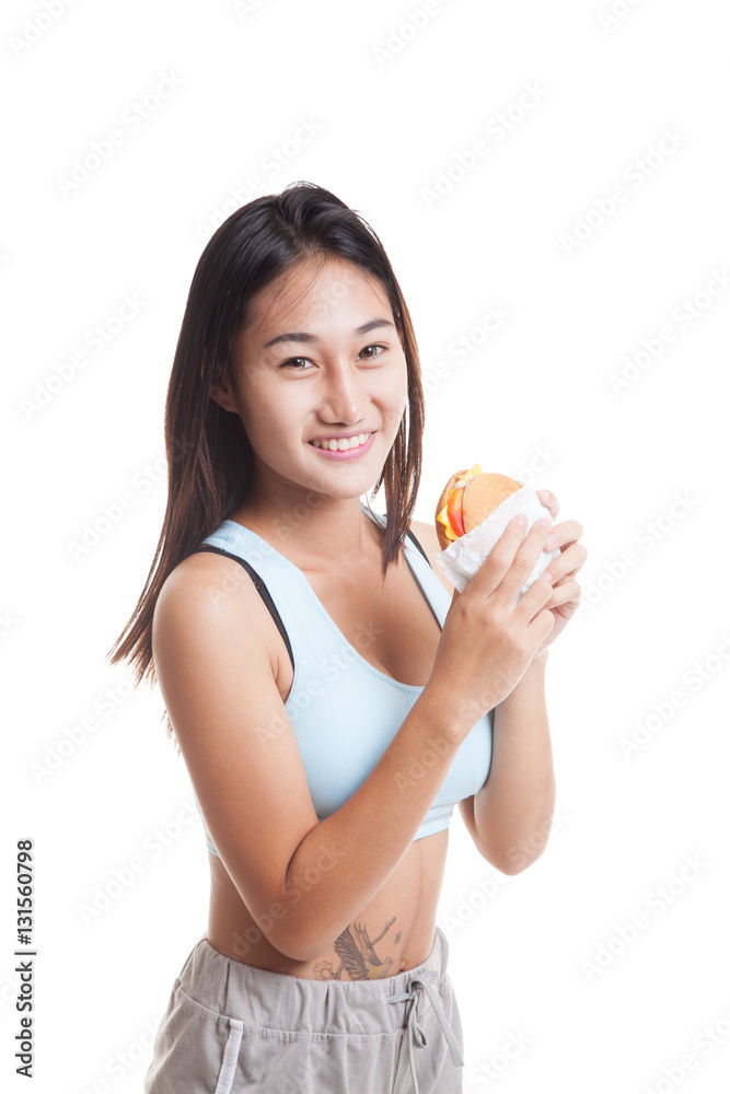 Beautiful Asian healthy girl enjoy eating hamburger. Beautiful Asian healthy girl enjoy eating hamburger.