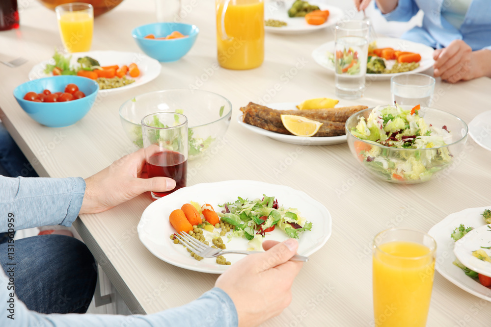 Close up view of man having lunch at home