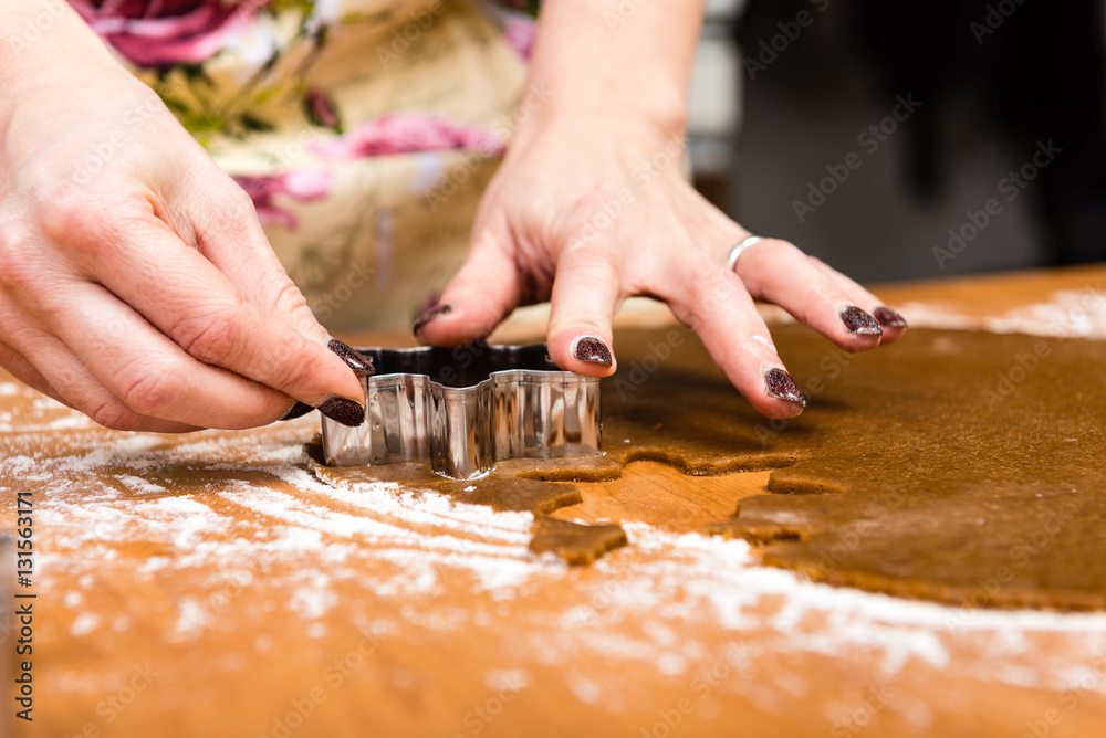 Making Gingerbread Cookies Series. Cutting dough sheet into shap