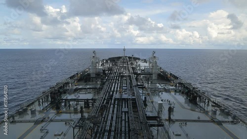 Oil tanker is underway in rain.