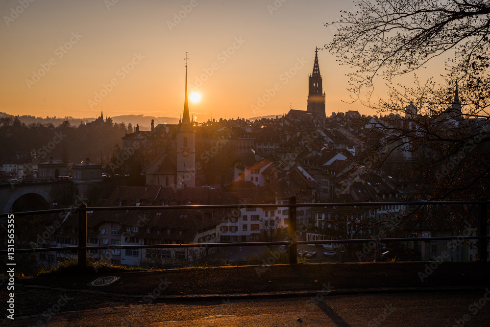 Naklejka premium A cityscape of Bern, medival city in Switzerland in the late evening with a soft fog.