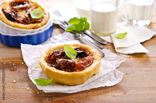 Open pies with dried tomatoes