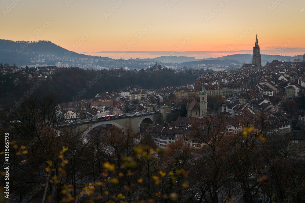 A cityscape of Bern, medival city in Switzerland in the late evening with a soft fog.