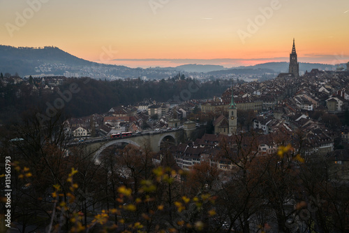 A cityscape of Bern  medival city in Switzerland in the late evening with a soft fog.