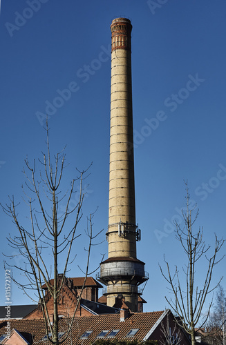 The chimney of a brick in an old gasworks in Poznan.