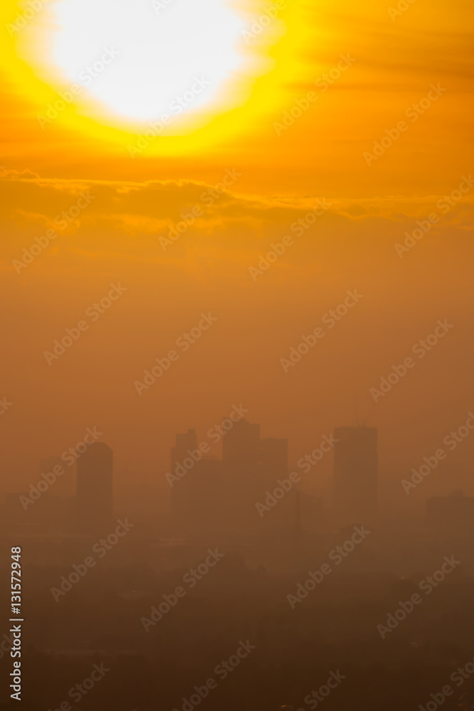 Sunrise over downtown Bangkok in cloudy day.  Silhouette citysca