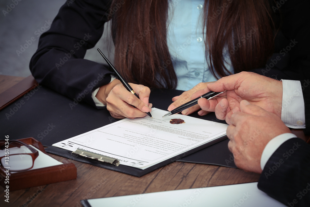 Notary with client in office