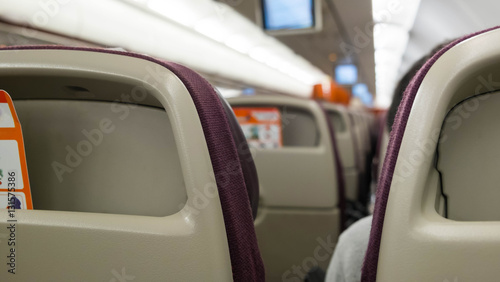 Interior of airplane with passengers on seats