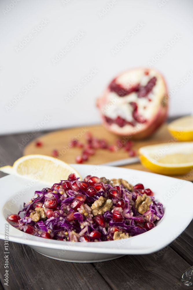 salad of red cabbage, pomegranate, apple and walnuts salad of red cabbage, pomegranate, apple and walnuts